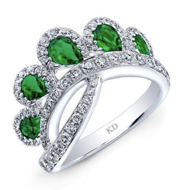 Emerald ring with diamonds around it